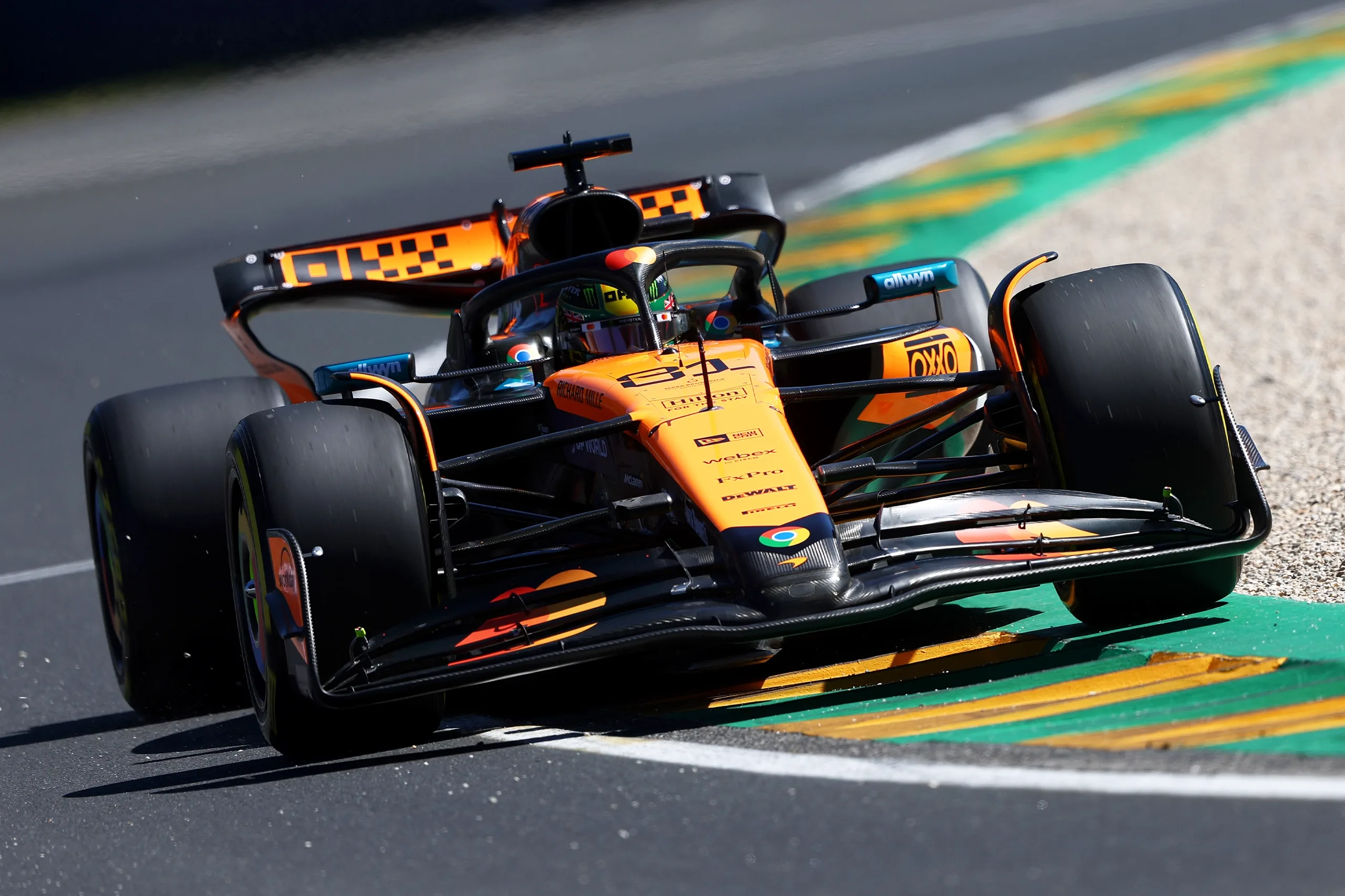 Placeholder image of race cars on the track